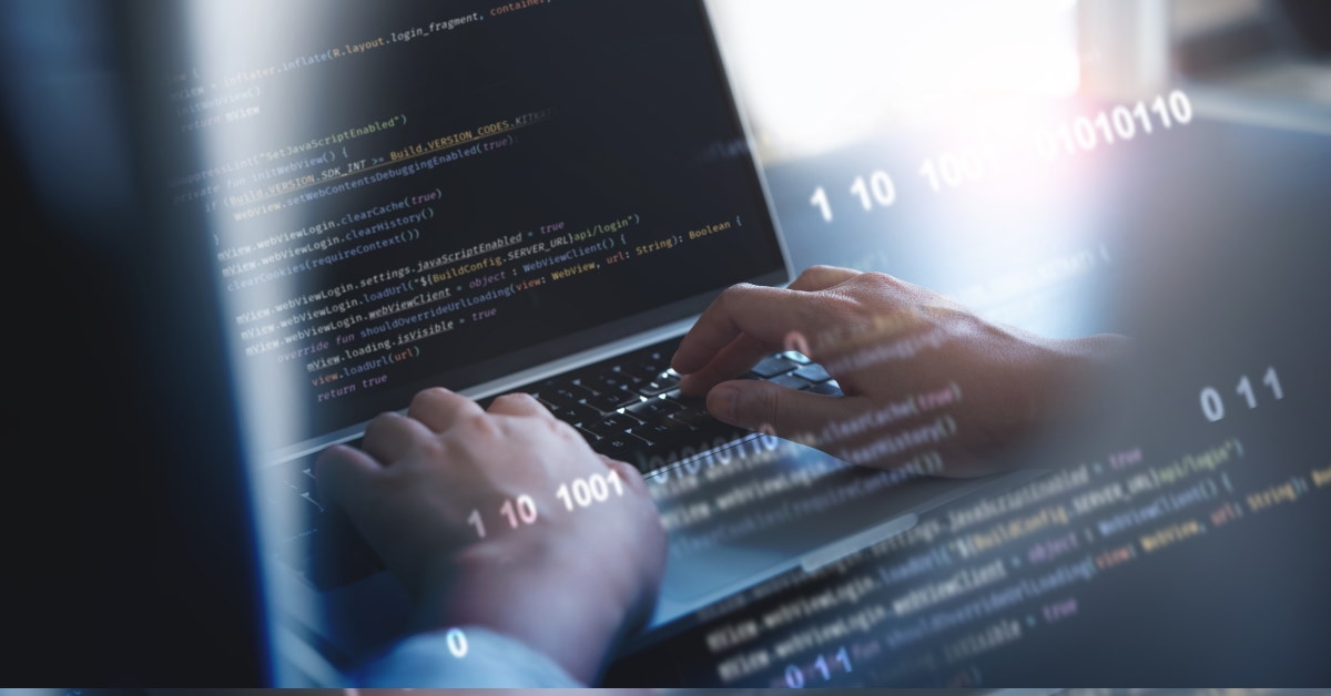 man using laptop to develop software