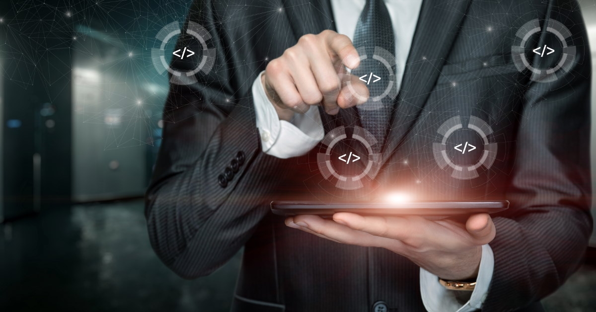 man using tablet to code