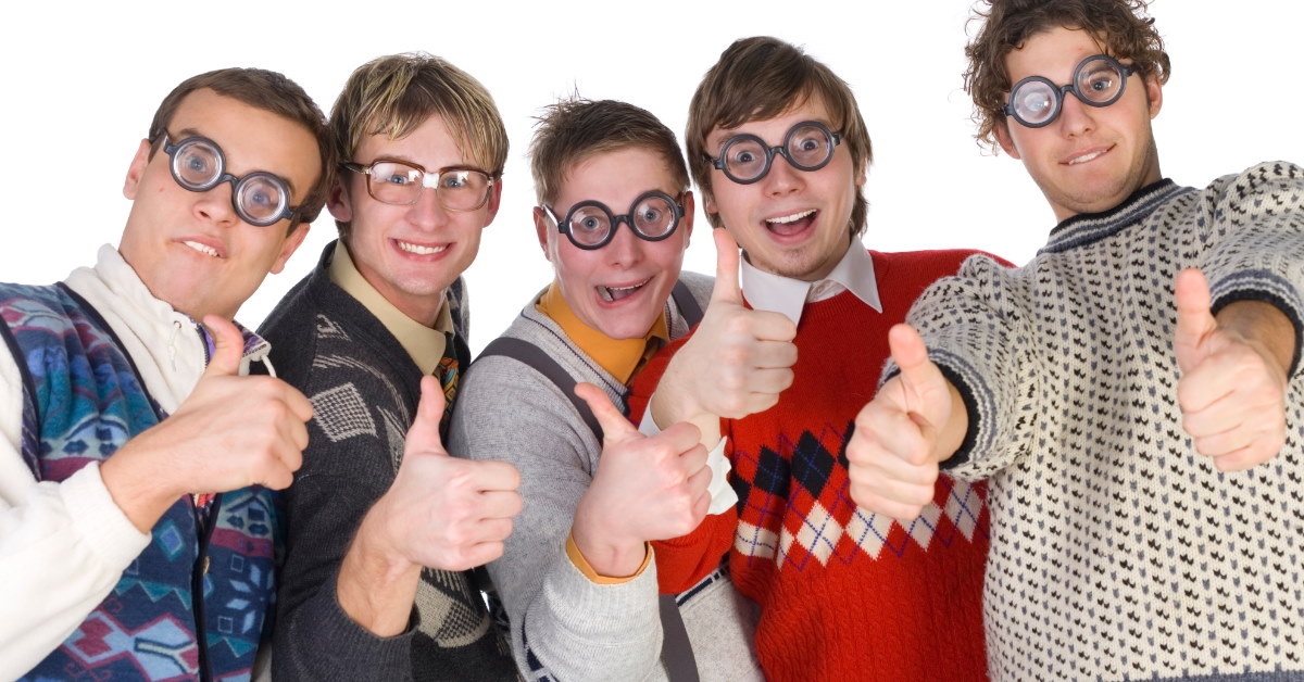 men in sweaters and glasses giving thumbs up