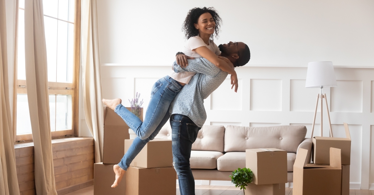couple first time home buyers celebrate moving day