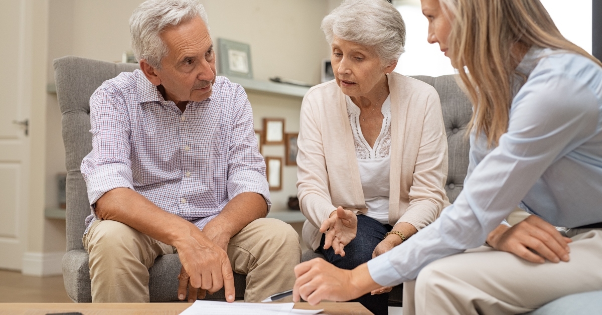 senior couple discussing investment