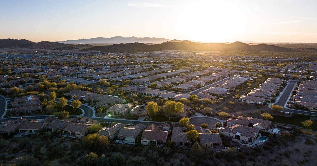 arizona suburb with greenery and buildings at sunrise