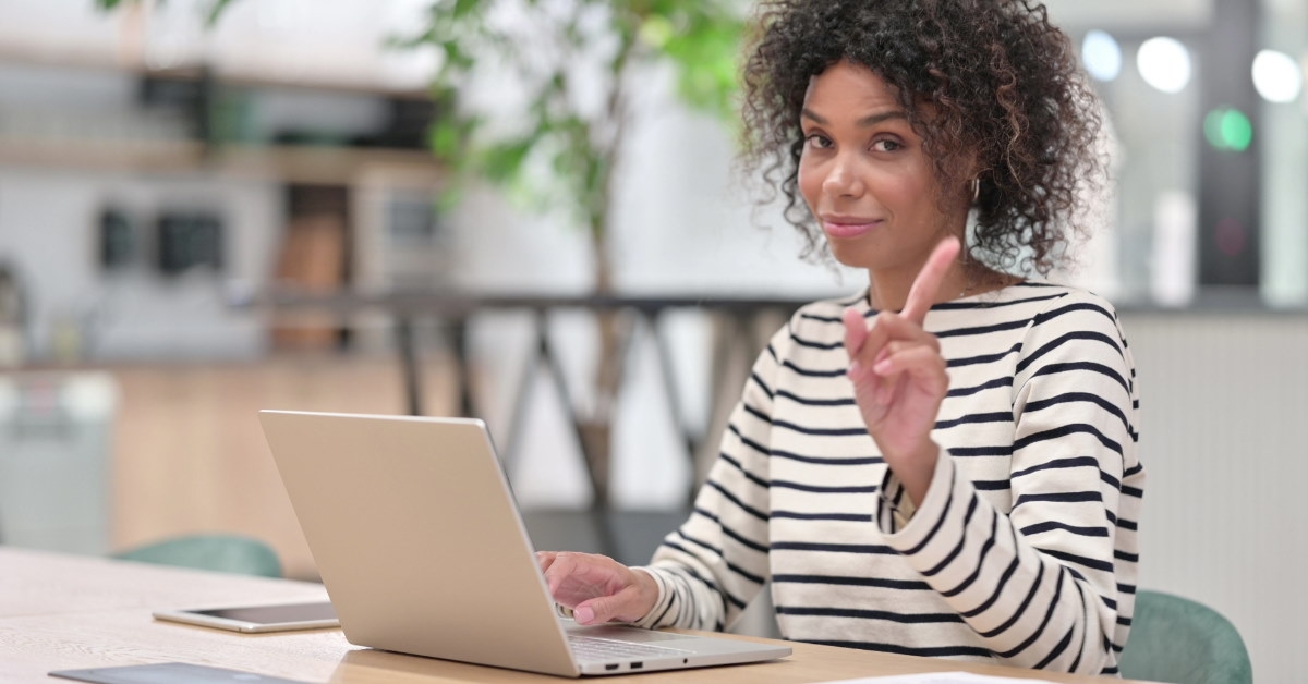 woman using laptop at table