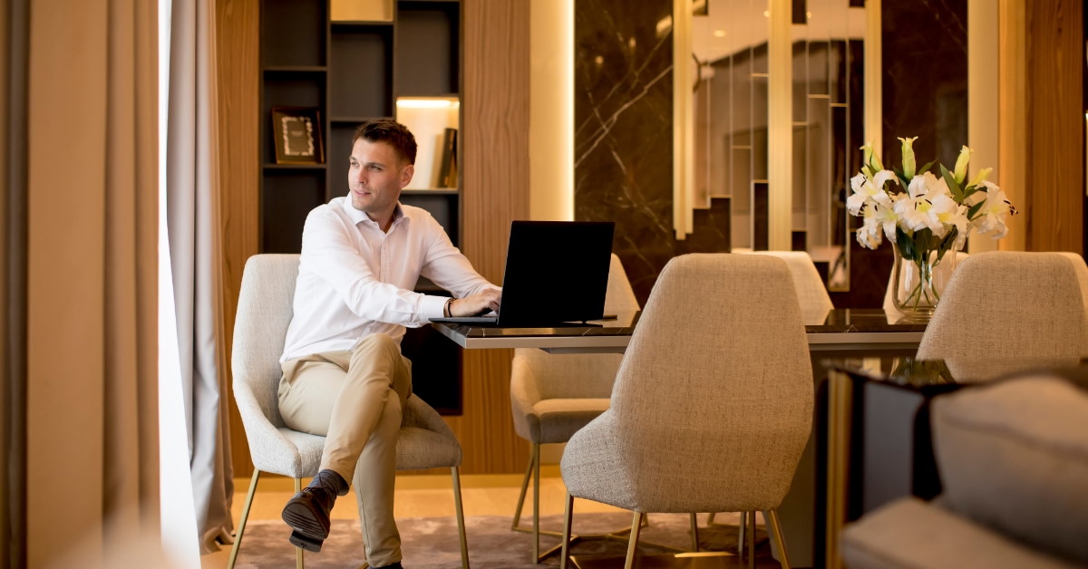 businessman working at table in luxurious room