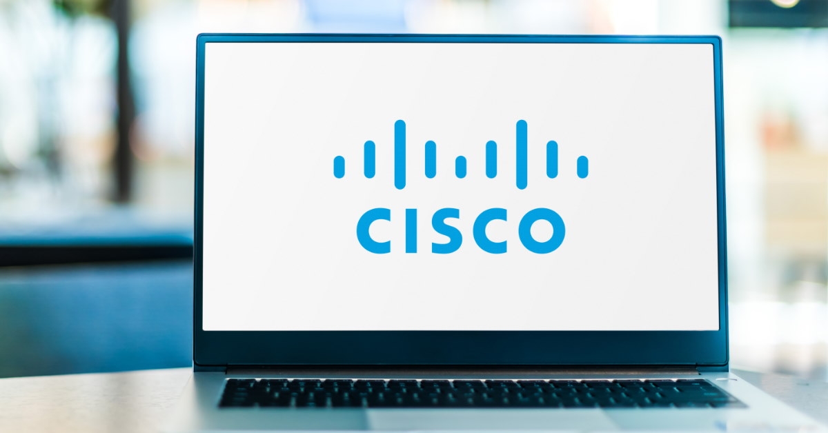 table having laptop with cisco logo