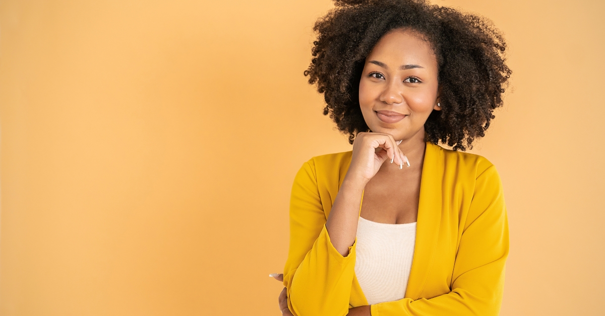 black woman in yellow office suit