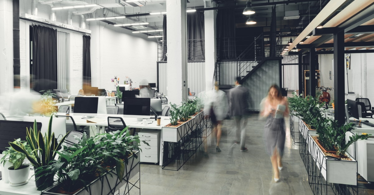 blurrred portrait of modern office with business woman and man walking