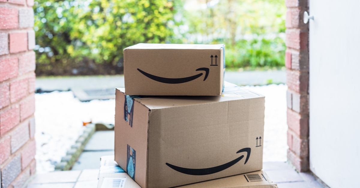 Amazon boxes stacked on a porch