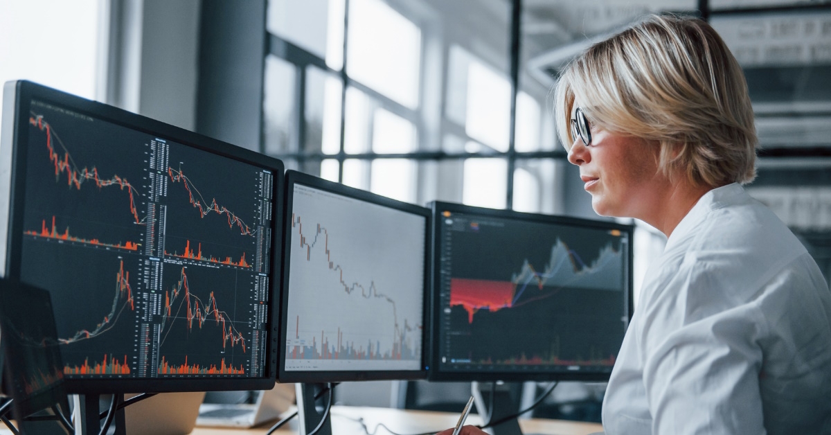female data analyst working late at night at office