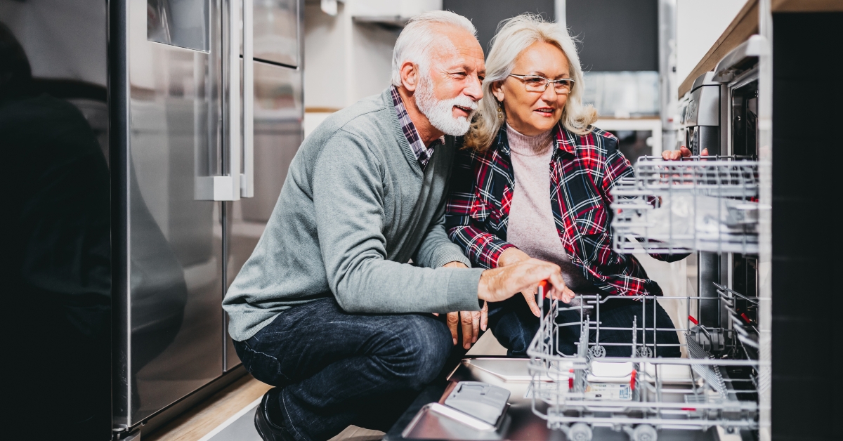 Couple buying a new dishwasher