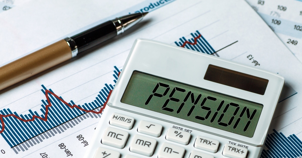 stock market graph with calculator having pension written on display