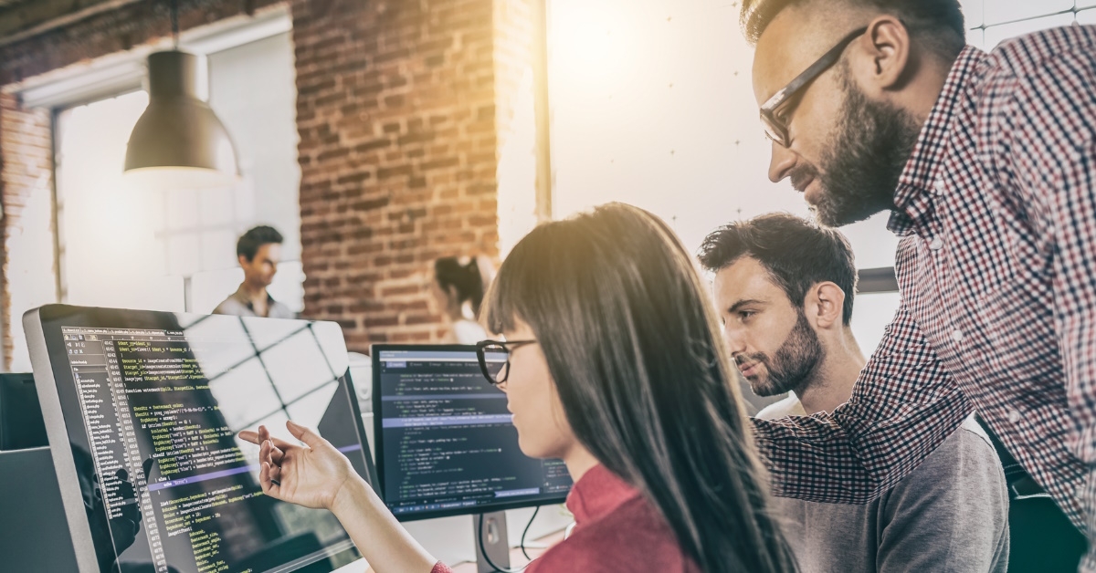 female software developer with male manager designing website