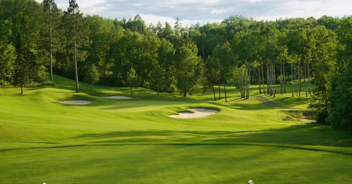 golf course with bunkers during day time