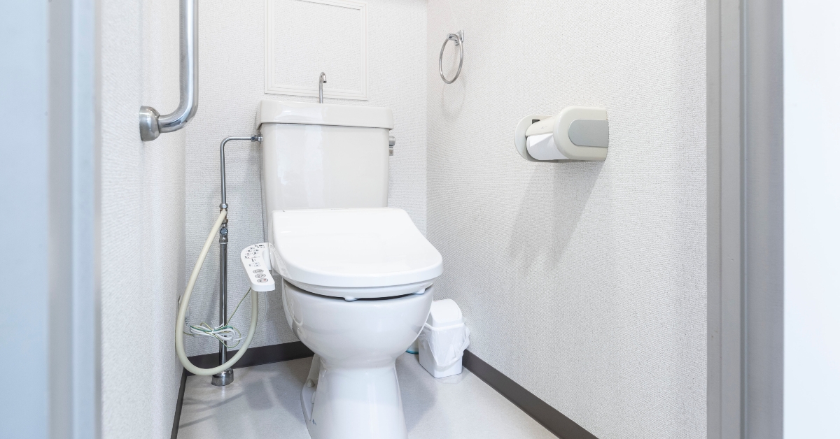 automatic toilet in a clean white bathroom