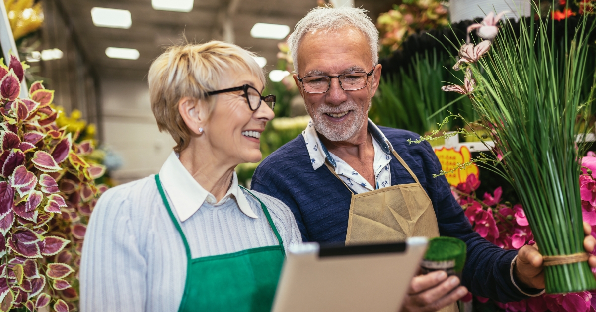 elderly couple in own flower shop