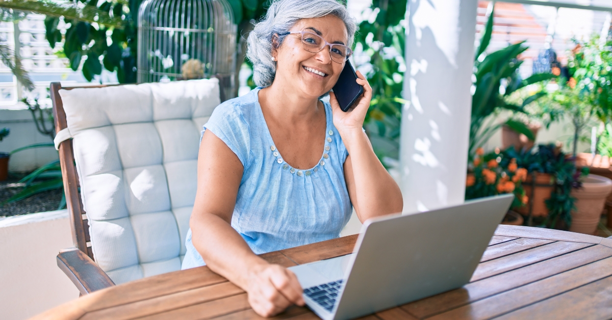 middle aged woman with grey hair smiling