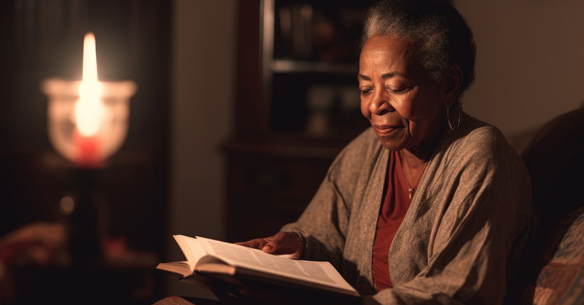 senior woman reading books in living room