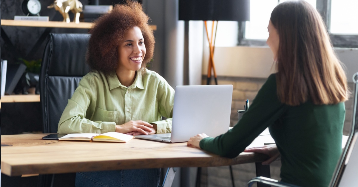 ffrican american female HR manager having an office conversation with a female candidate