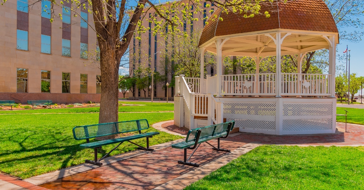 green park with benches and trees in lubbock town square