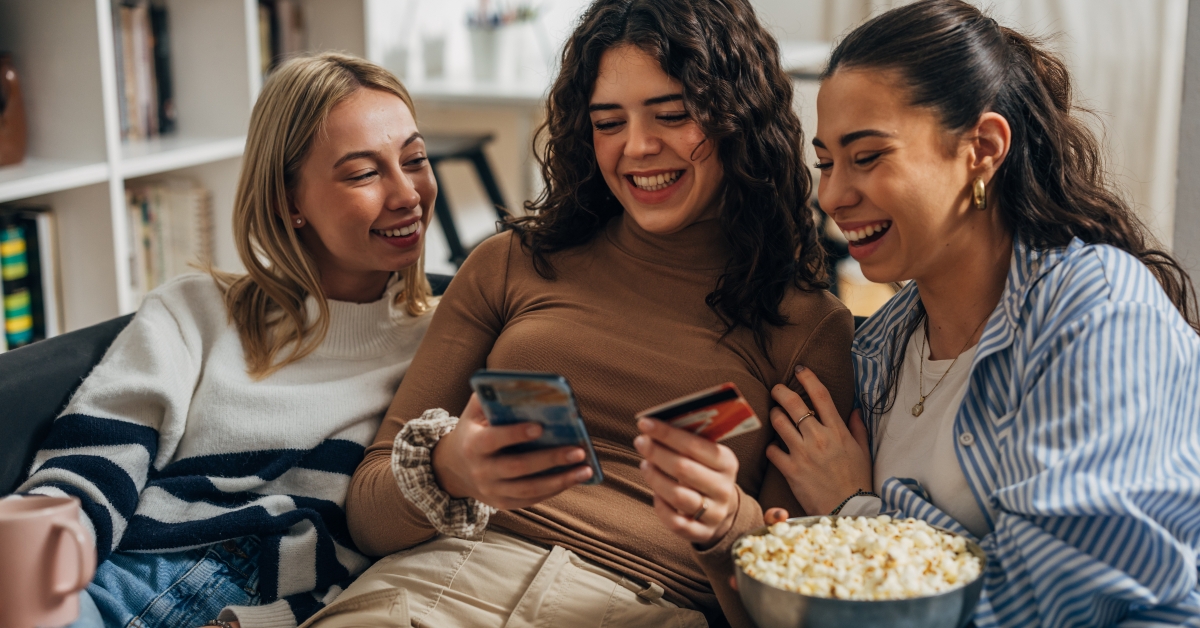 friends are having fun shopping online