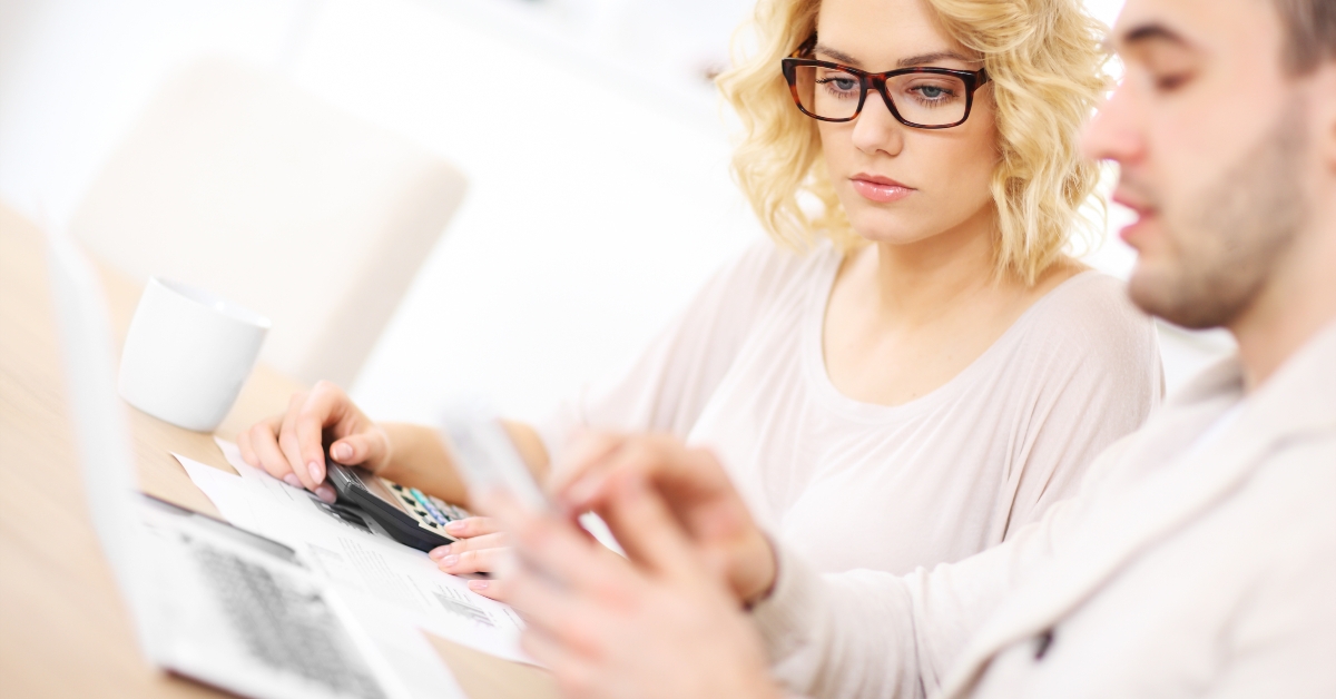 unhappy couple with documents at home