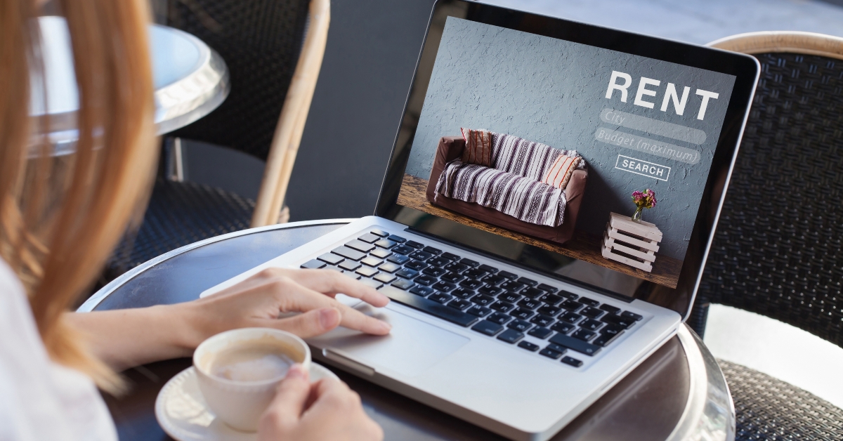 woman using internet website for rental apartments