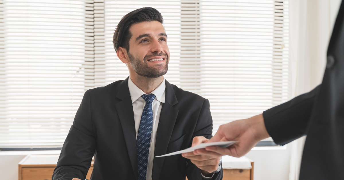 office worker receiving salary from boss