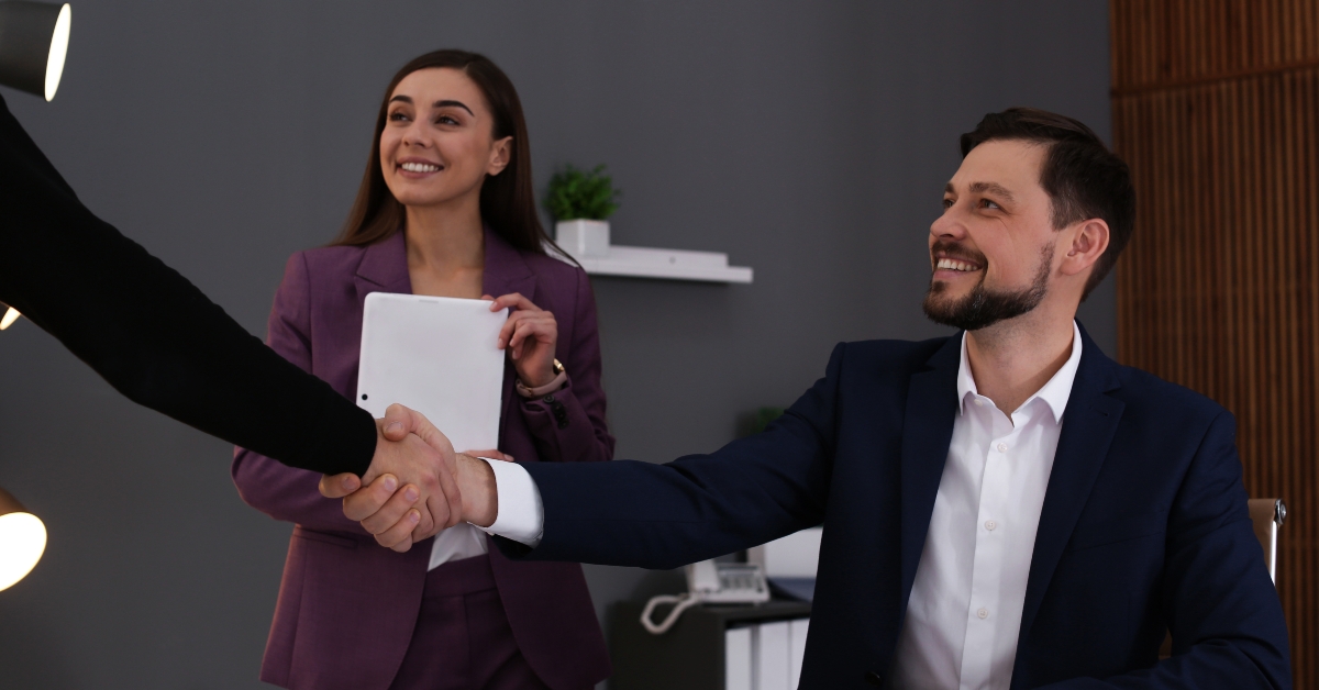 businessman and client shaking hands