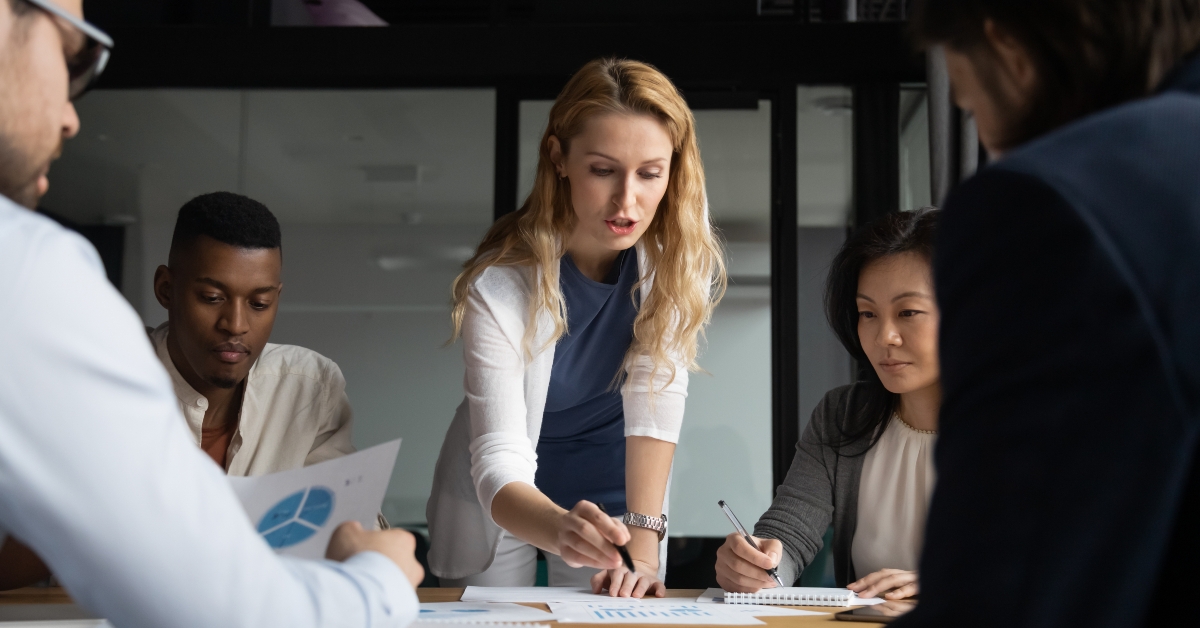 young businesswoman explaining research results in graphs