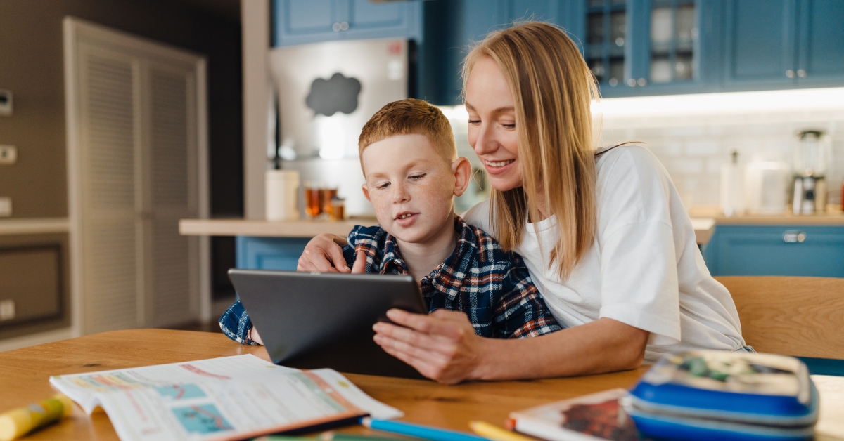 mom with her son using tablet computer