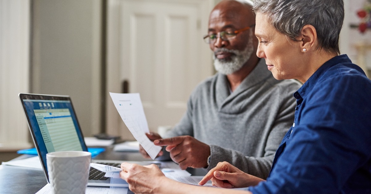 senior couple reviewing budget