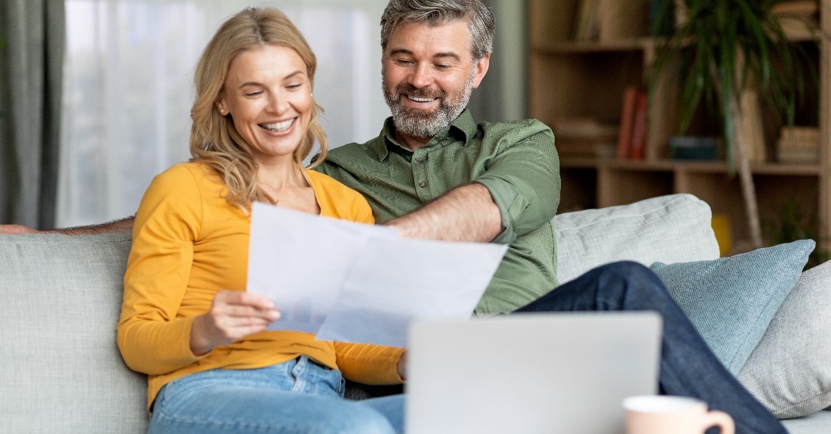 couple reading documents at home