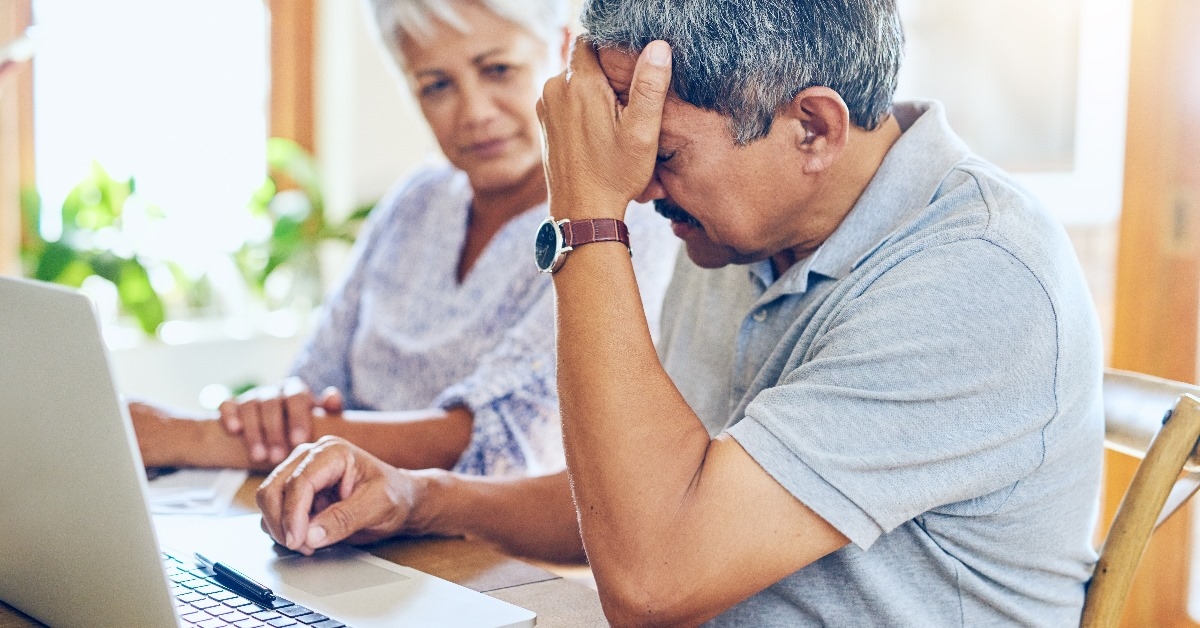 elderly man and woman calculating bills and taxes and worried for payment due to infalation and low annual income 