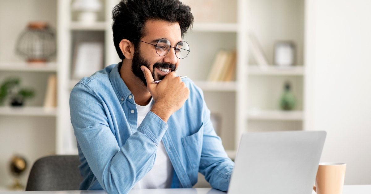 man working online with laptop at home