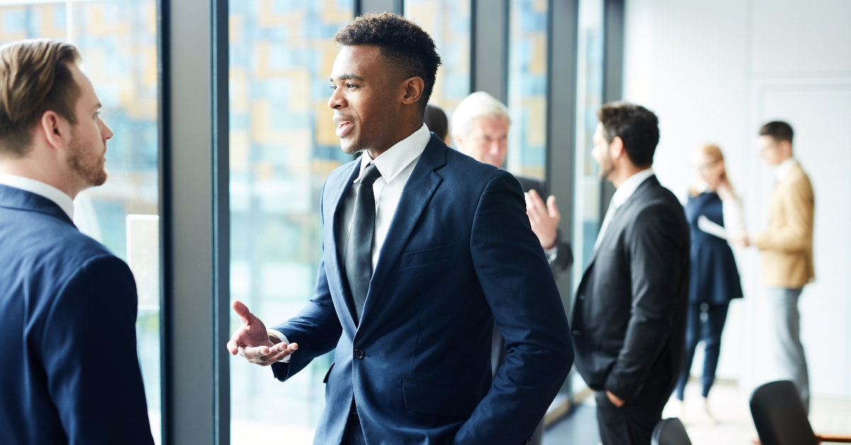 two intercultural delegates and their colleagues