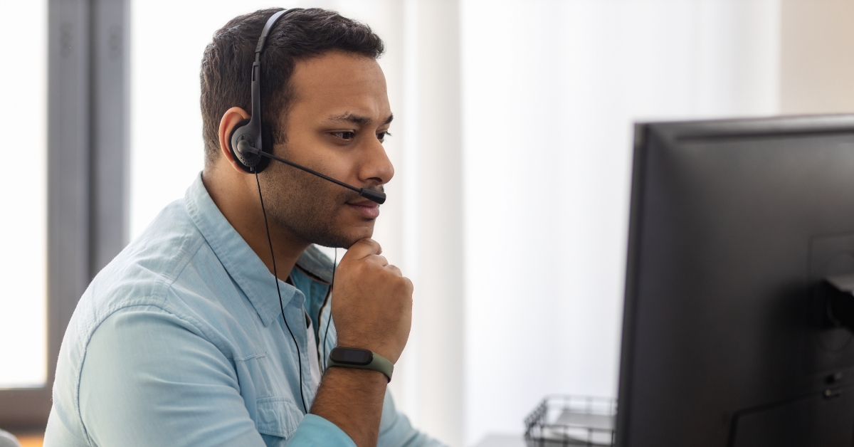 call center worker in headphone is working at modern office