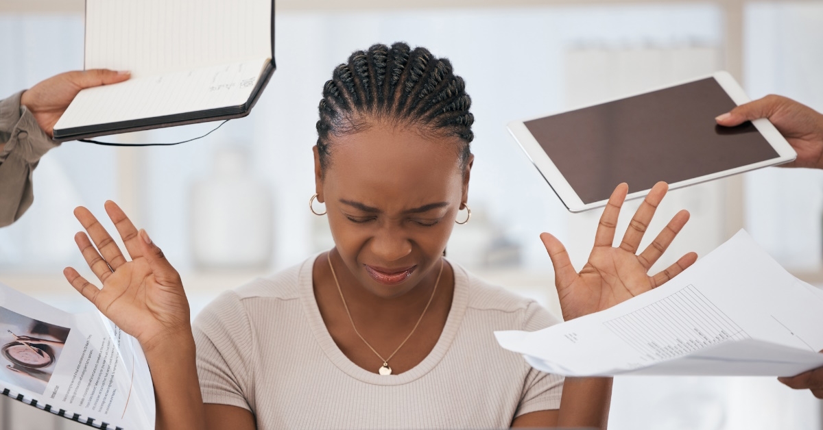 african american woman is exhausted due to workplace burnout.