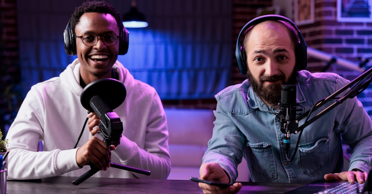 male influencers sitting in studio doing podcast 
