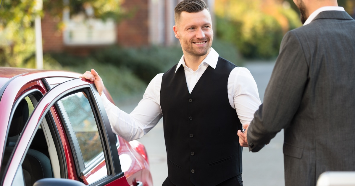 male valet shaking hand