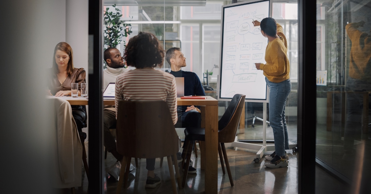 project manager standing inside meeting room
