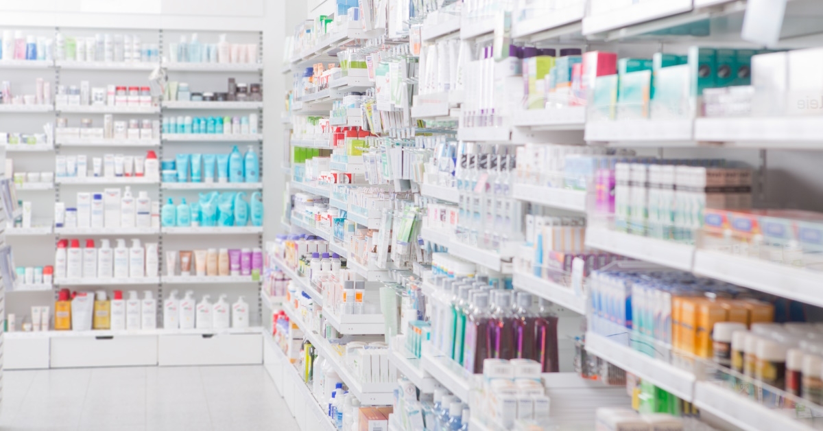 cosmetics area of a pharmacy with large number of skin and hair care products of different brands