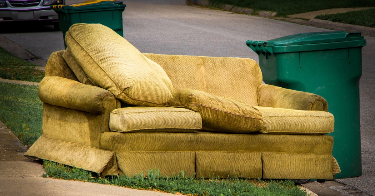 old yellow couch with cushions