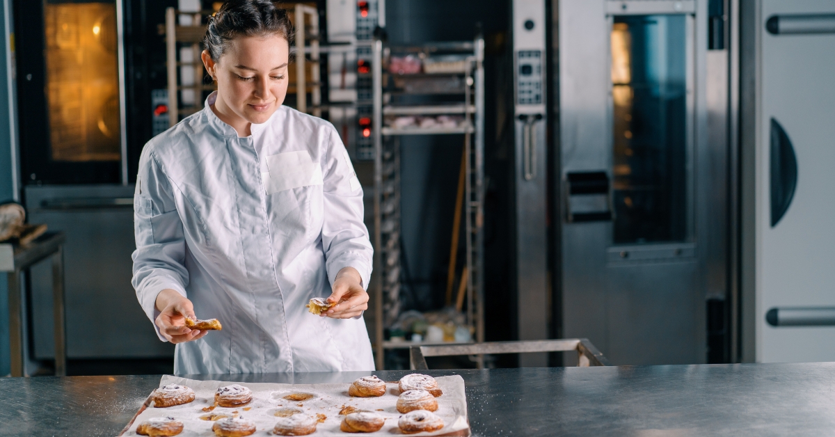 woman baker tears ready freshly baked buns