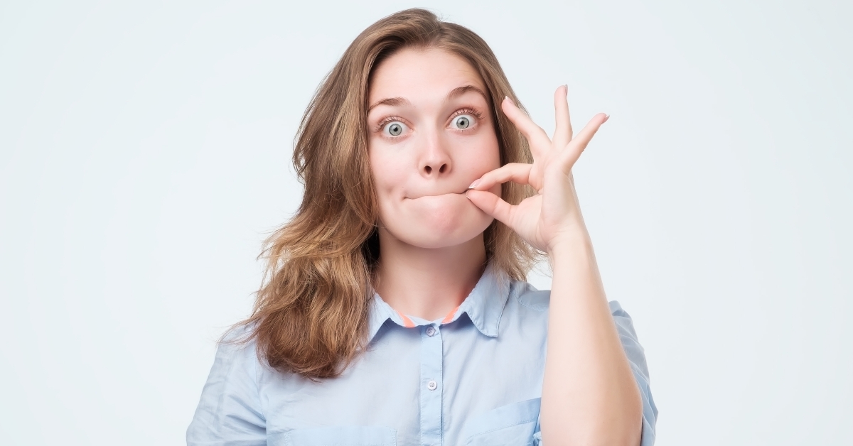 woman zipping her mouth shut