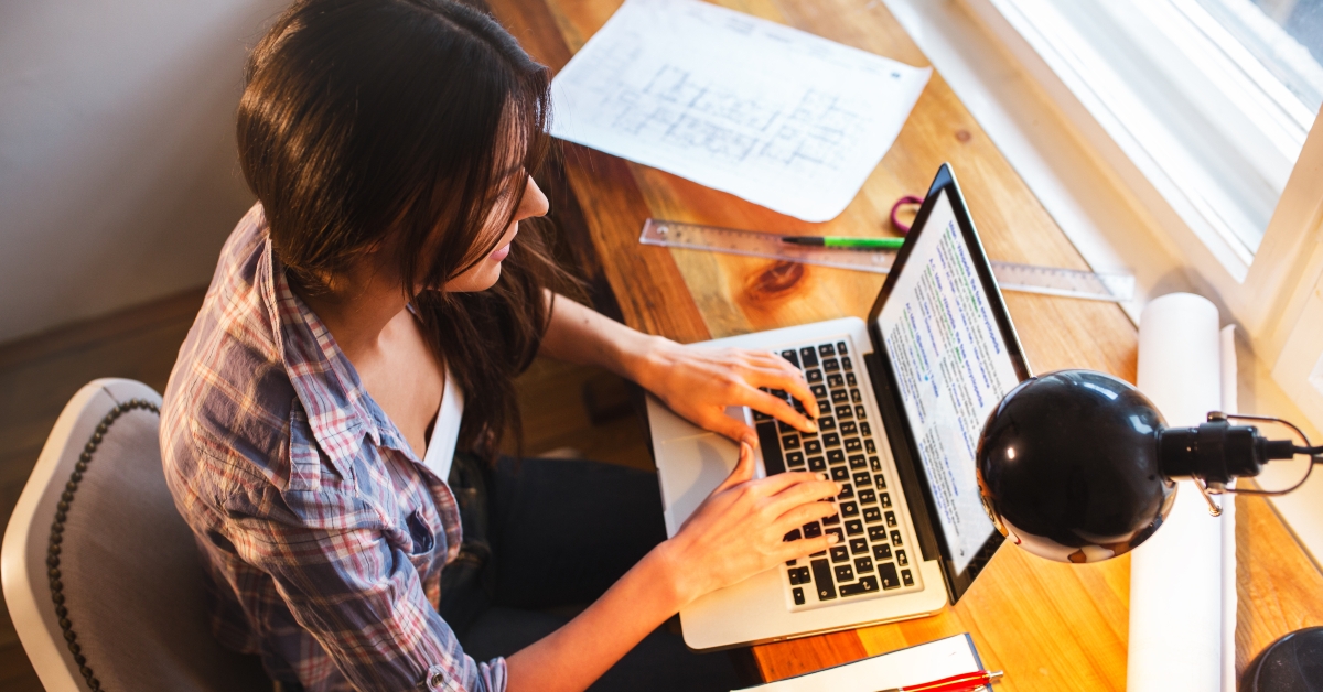 young female blogger working at home