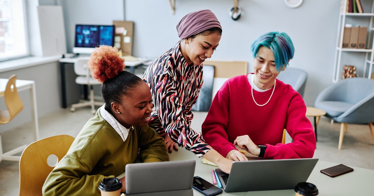 creative young people using laptop during meeting