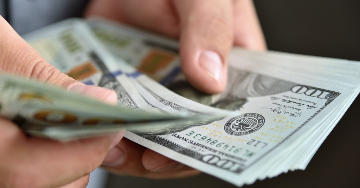 businessman counts money in hands