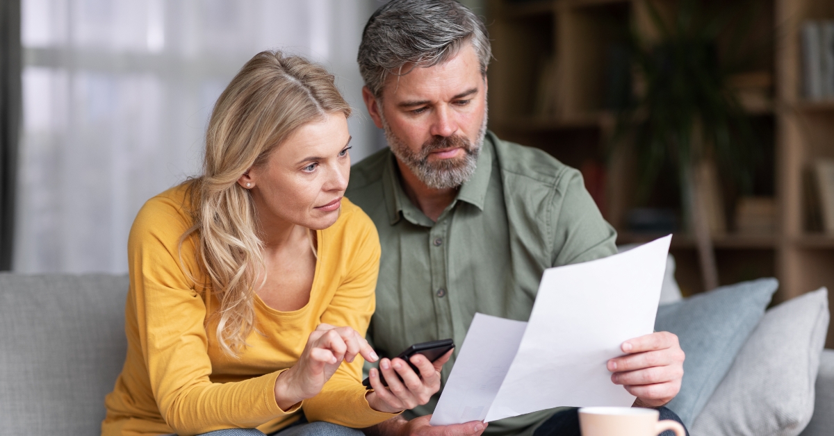 married middle aged couple planning budget together