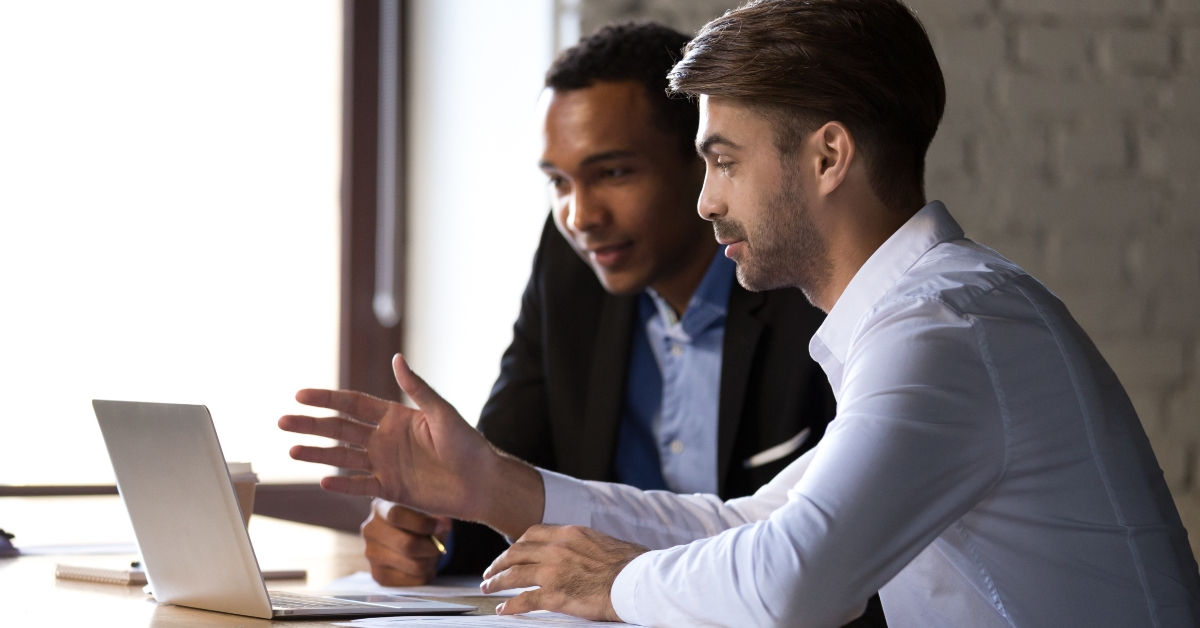 mentor teaching black intern
