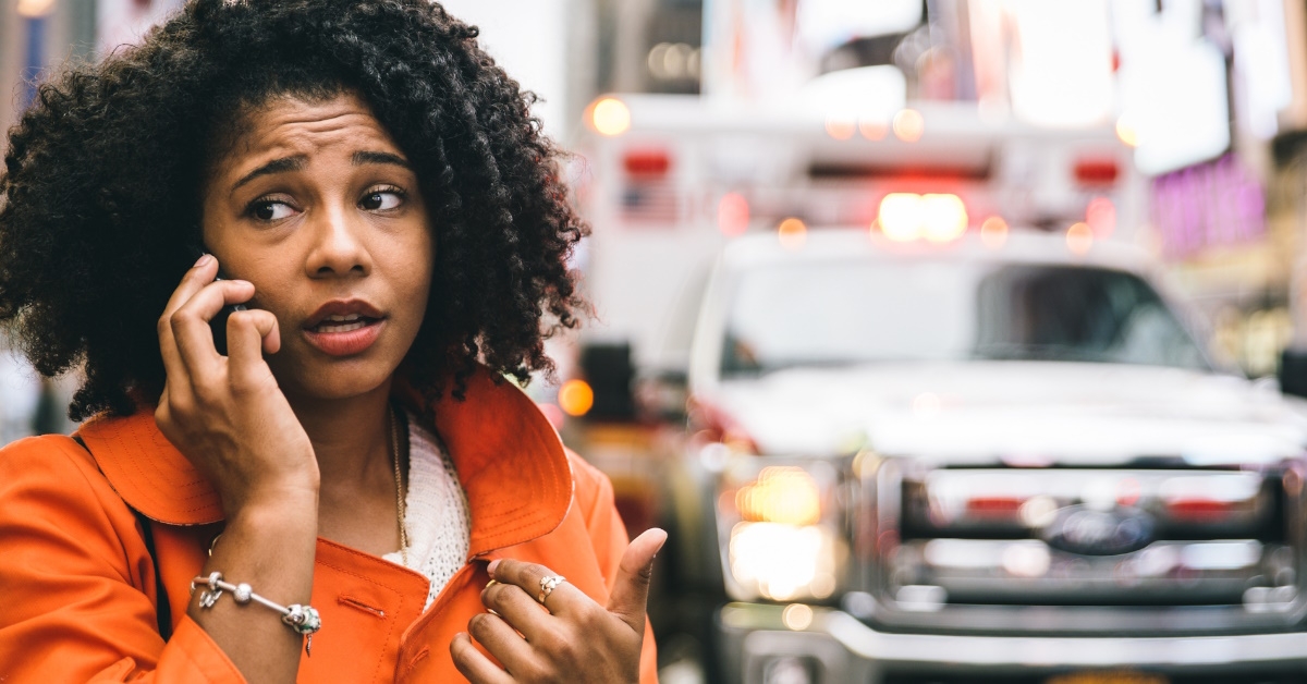 african american woman talking on phone to 911